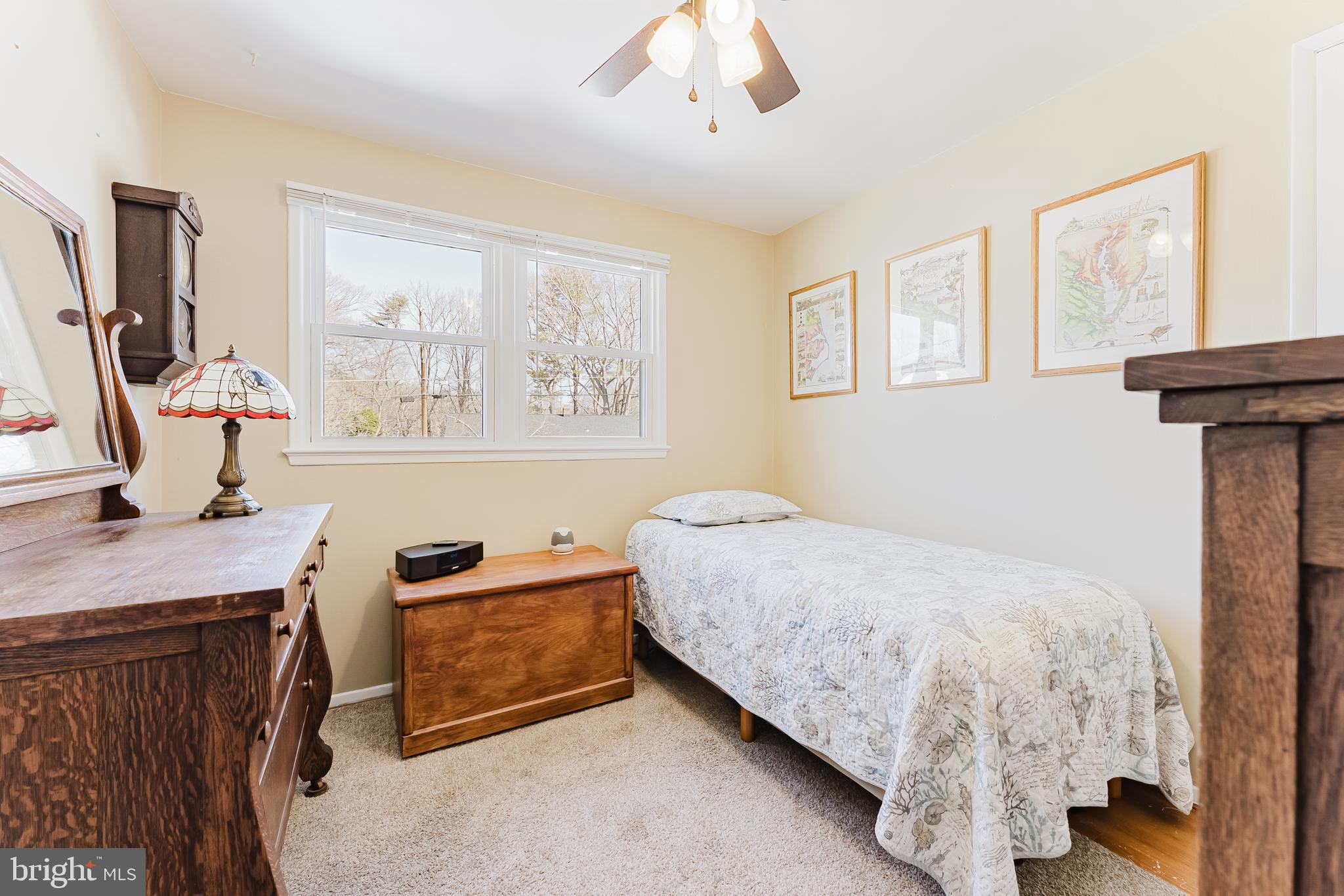 5937 Atteentee Road Springfield, VA 22150 - Photo 18 of 44 a bedroom with a bed and a flat tv screen on the dresser