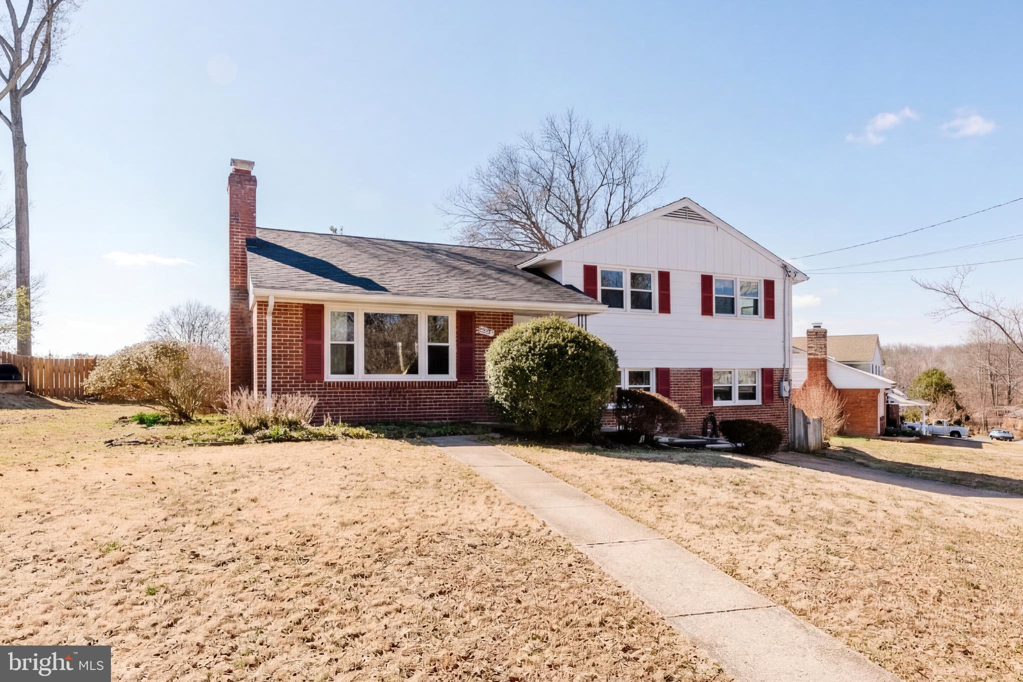5937 Atteentee Road Springfield, VA 22150 - Photo 28 of 44 a view of a house with a yard covered in snow