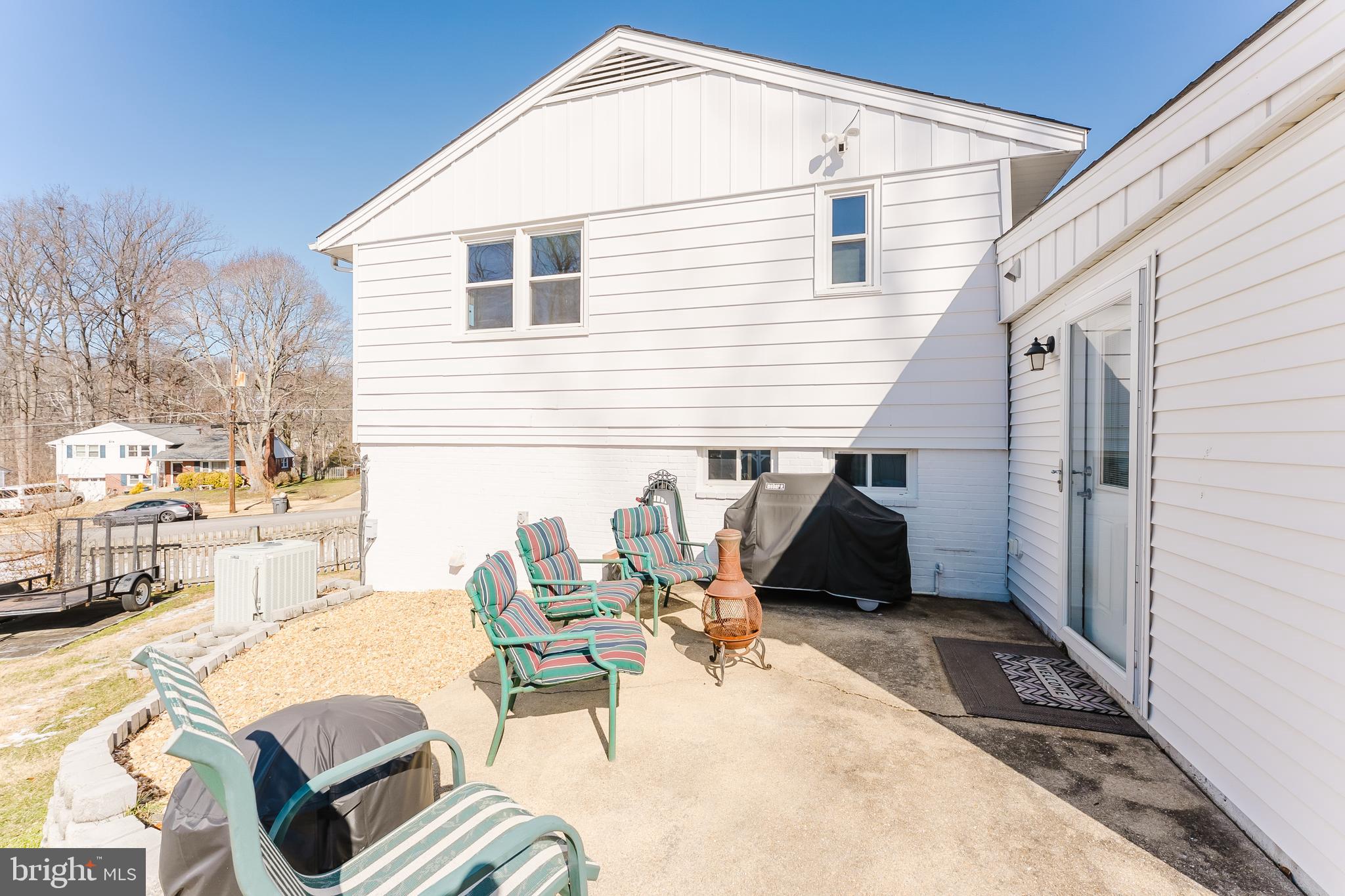 5937 Atteentee Road Springfield, VA 22150 - Photo 30 of 44 a backyard of a house with outdoor seating