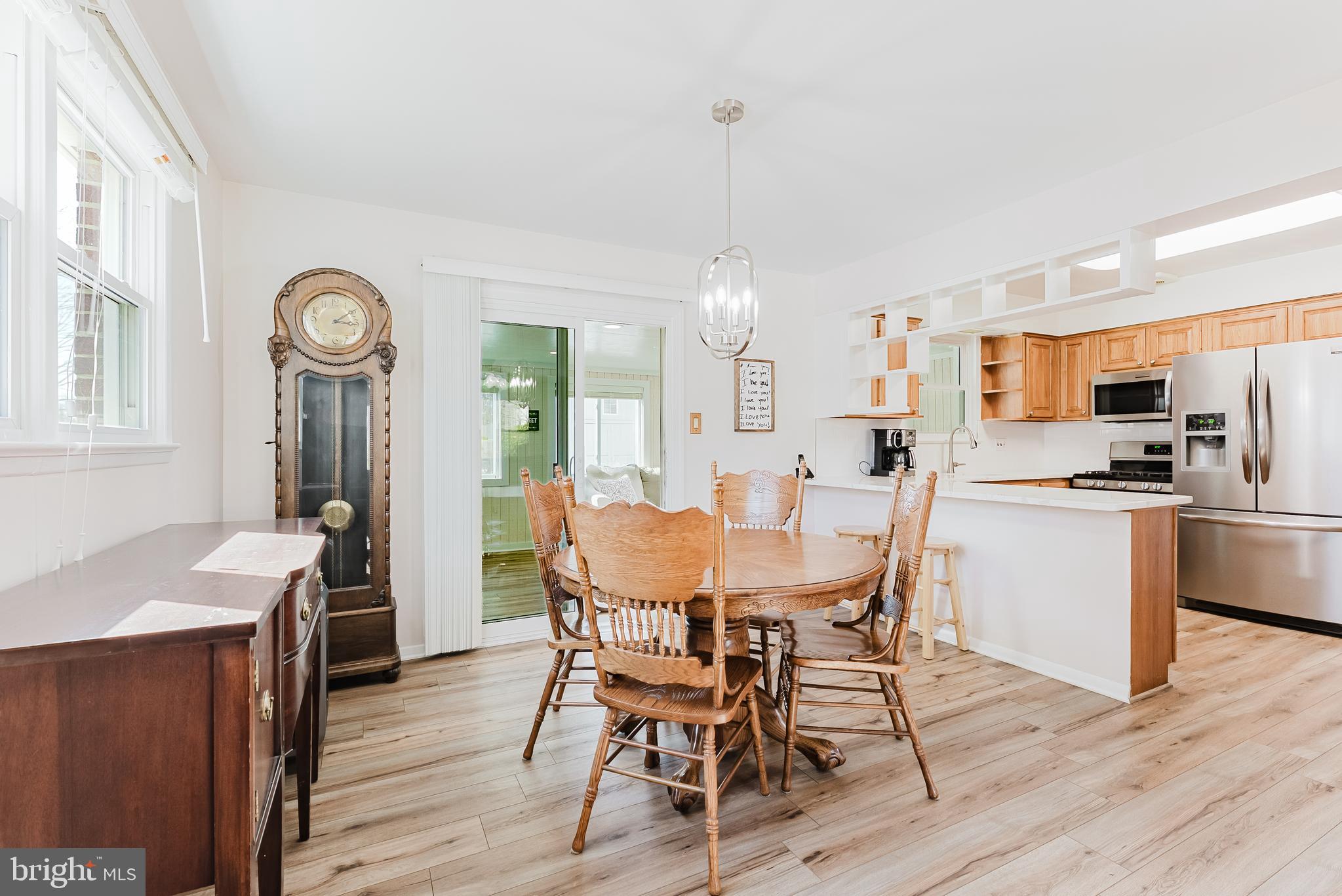 5937 Atteentee Road Springfield, VA 22150 - Photo 5 of 44 a view of a dining room with furniture window and wooden floor
