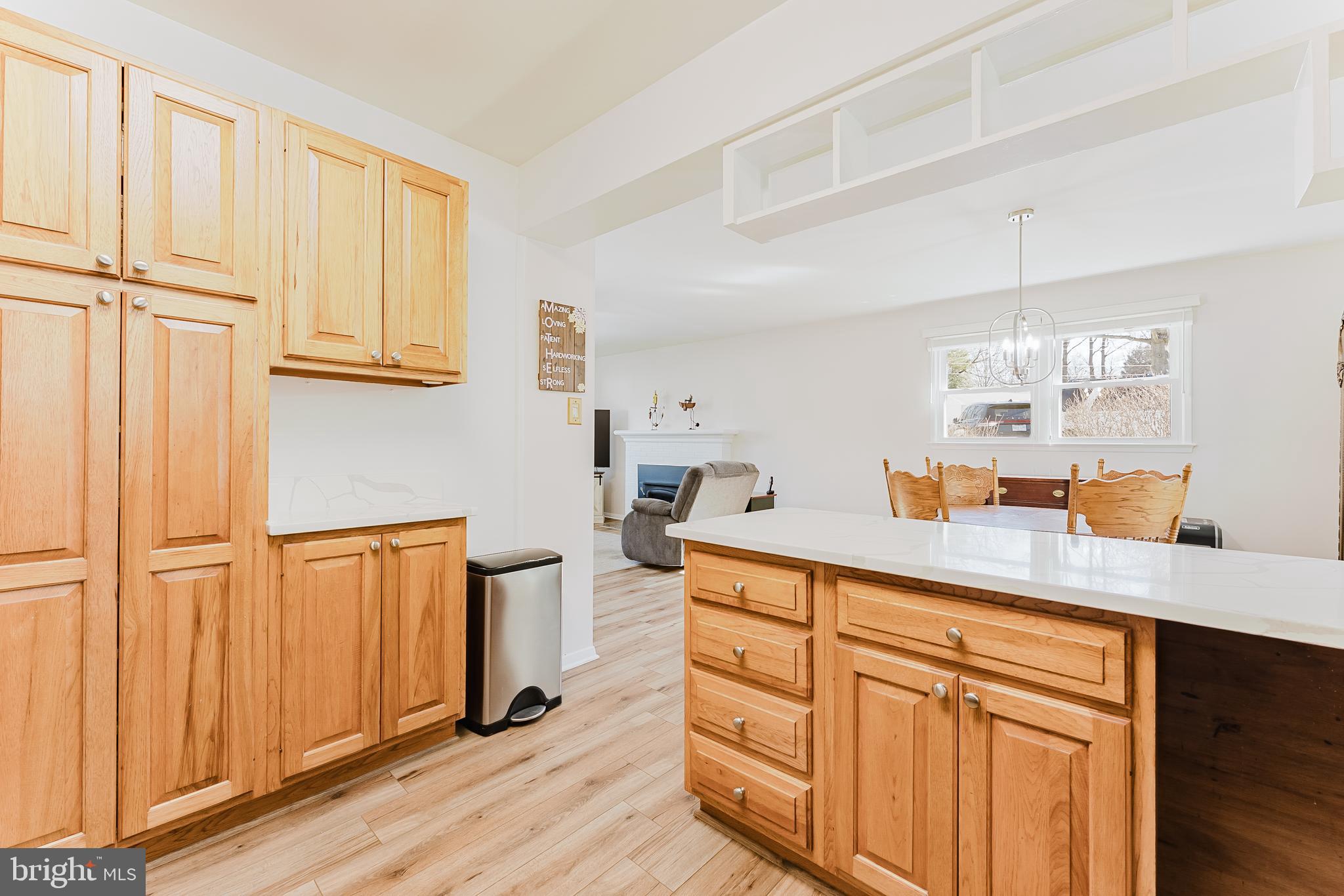 5937 Atteentee Road Springfield, VA 22150 - Photo 9 of 44 a kitchen with stainless steel appliances granite countertop a refrigerator a sink dishwasher and wooden cabinets with wooden floor