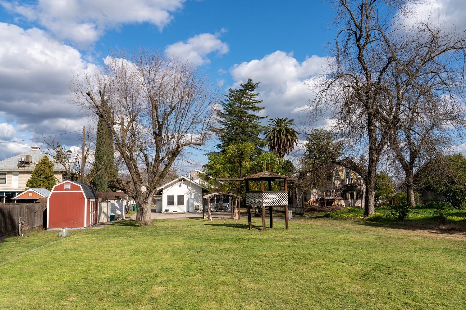 537 South Reed Avenue Reedley, CA 93654 - Photo 3 of 57 a view of a house with a yard