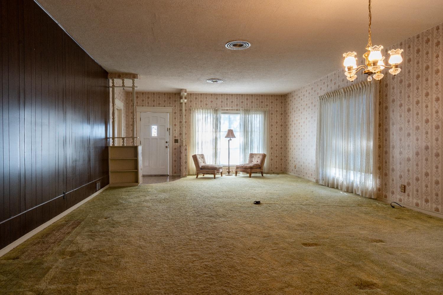 537 South Reed Avenue Reedley, CA 93654 - Photo 9 of 57 a view of an empty room with a chandelier