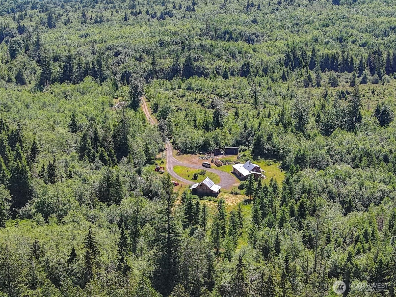 2904 Wildwood Road Quilcene, WA 98376 - Photo 19 of 39 a aerial view of a house with a lush green forest