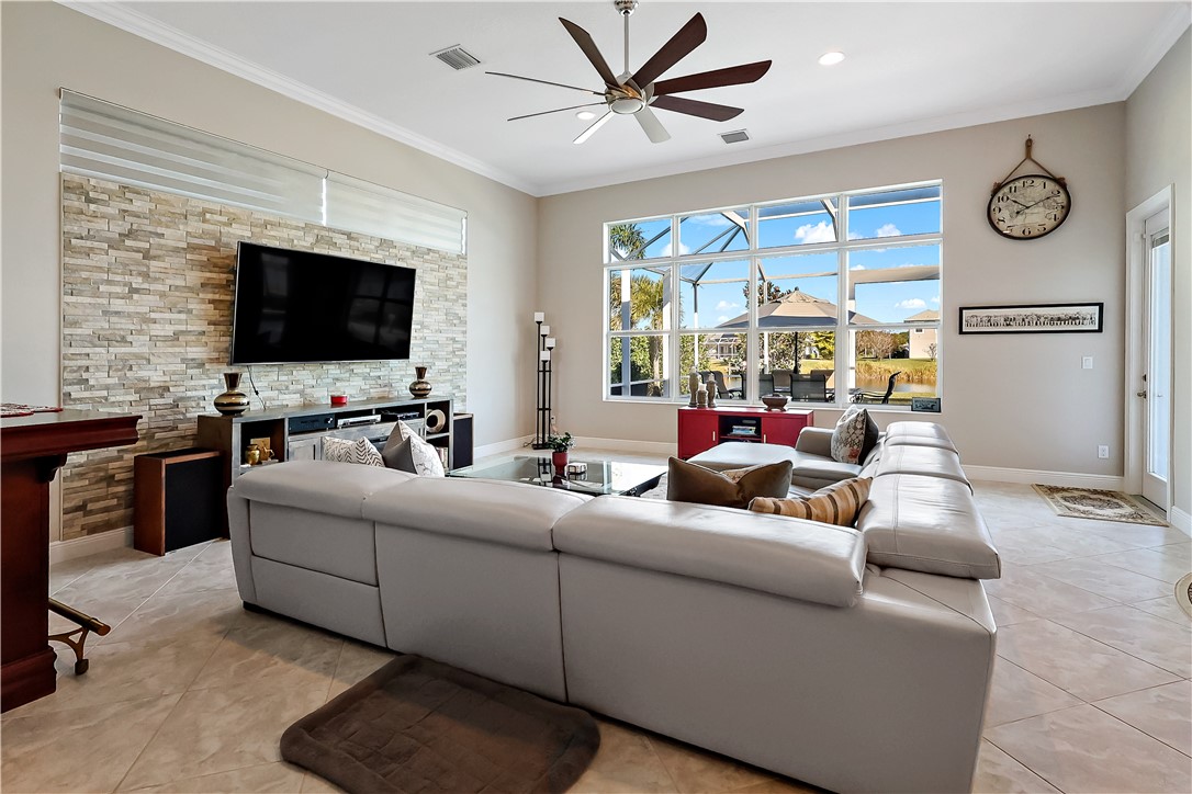 607 Yearling Trail Sebastian, FL 32958 - Photo 20 of 33 a living room with furniture and a flat screen tv