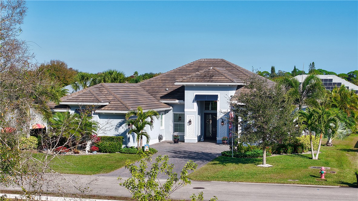 607 Yearling Trail Sebastian, FL 32958 - Photo 2 of 33 a front view of a house with garden