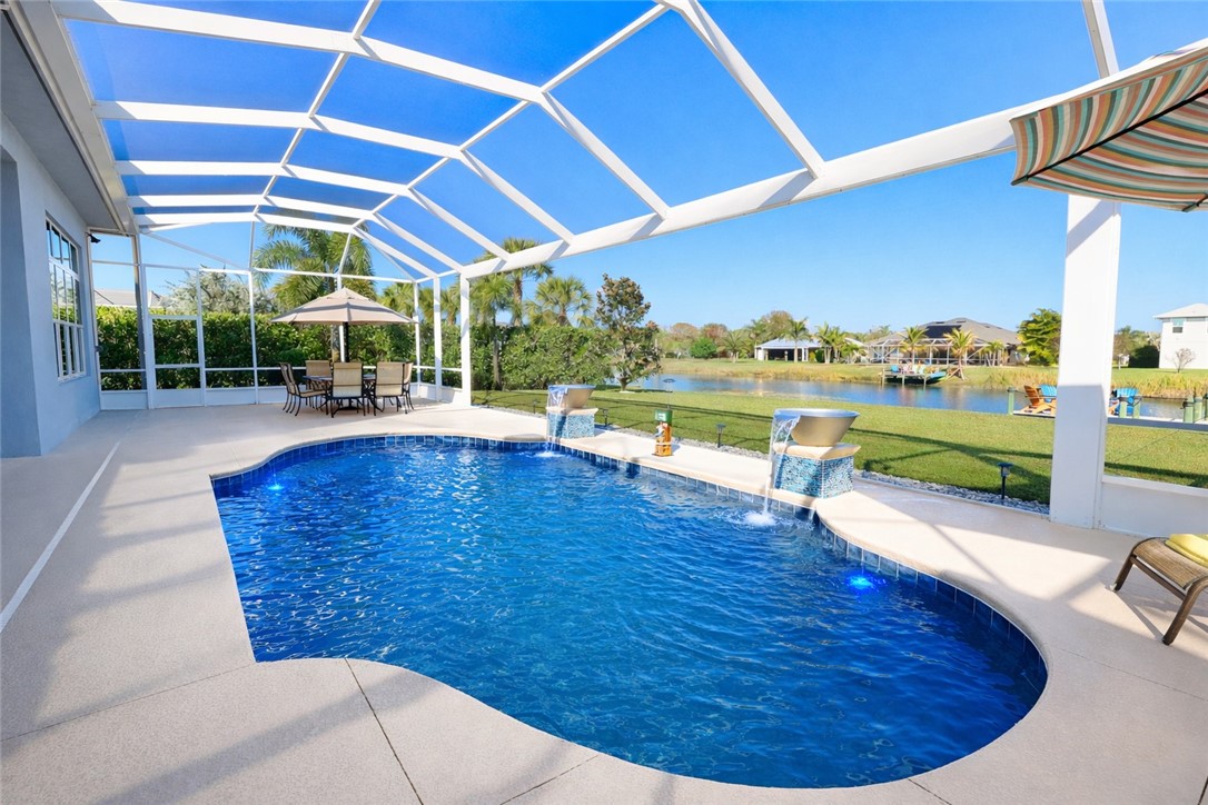607 Yearling Trail Sebastian, FL 32958 - Photo 29 of 33 a view of a swimming pool with a patio