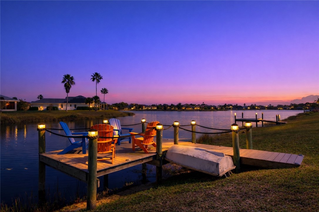 607 Yearling Trail Sebastian, FL 32958 - Photo 31 of 33 a view of a terrace with lawn chairs and a fire pit