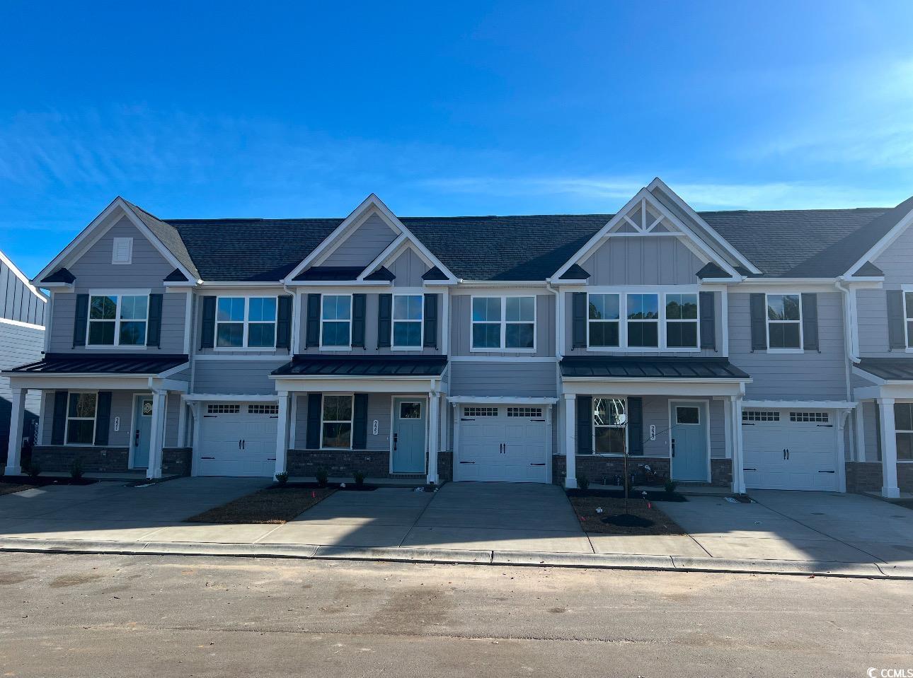 225 Bent Green, Unit 64E Murrells Inlet, SC 29576 - Photo 1 of 14 View of property with a garage