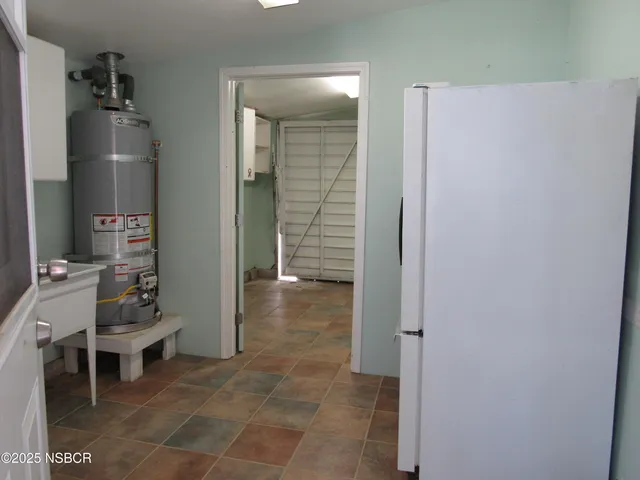 a view of a porch with furniture and a garage