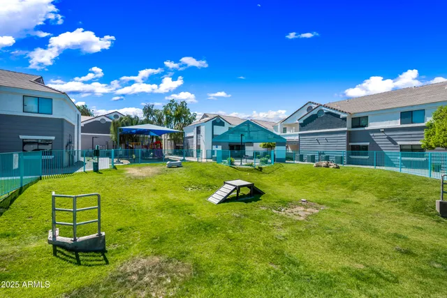 a view of backyard of house with outdoor seating