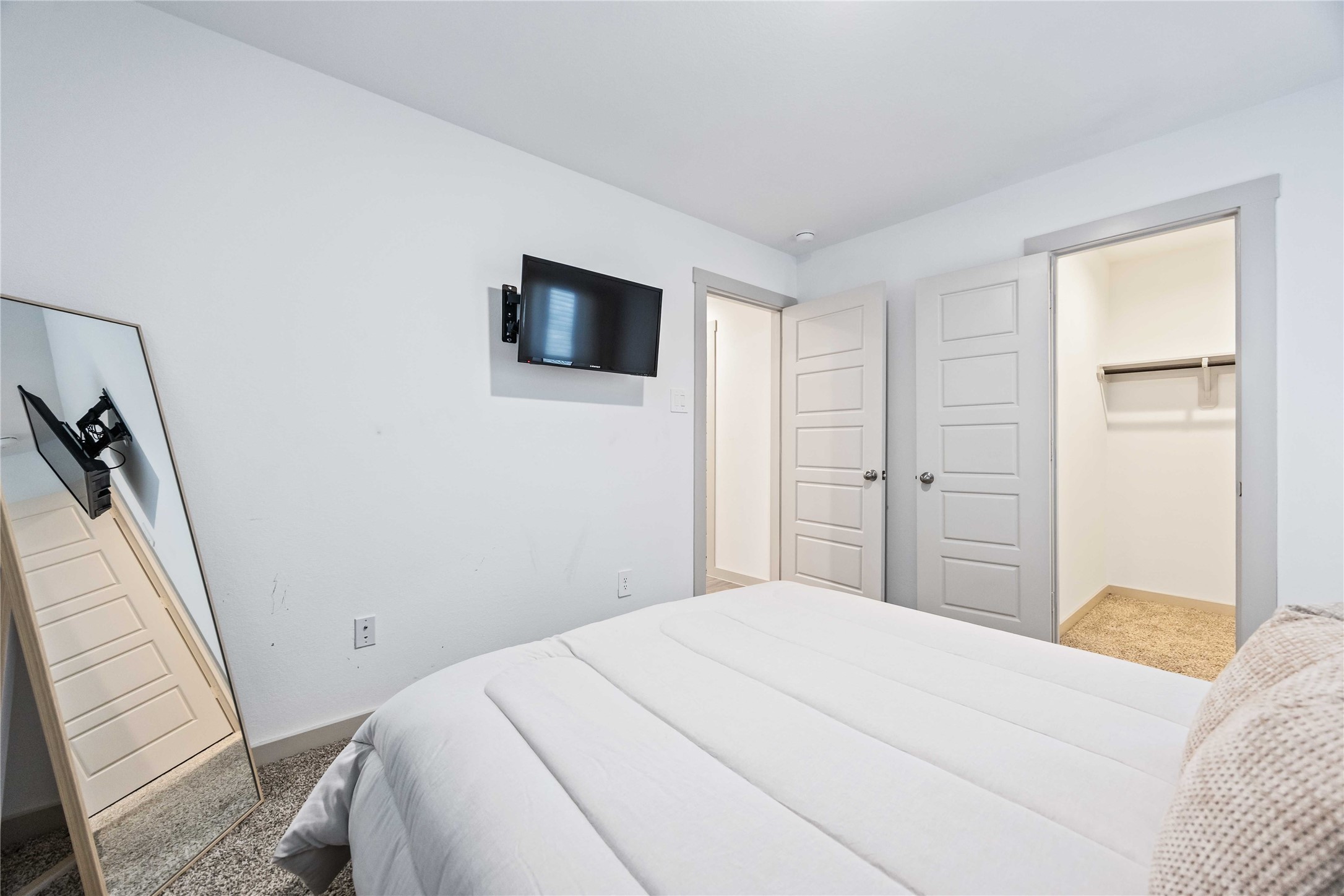 7826 Cattleman Vly Drive Rosharon, TX 77583 - Photo 15 of 29 a bedroom with a bed and a flat screen tv