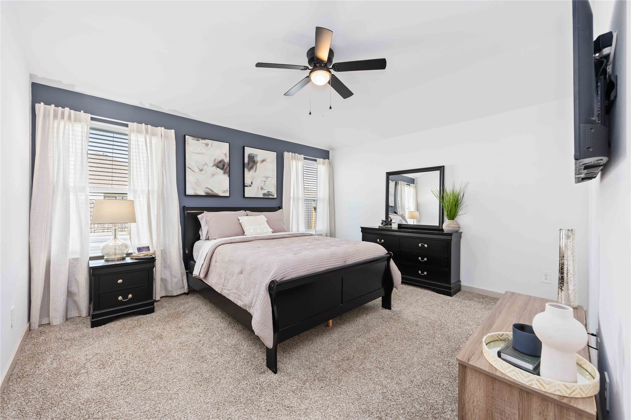 7826 Cattleman Vly Drive Rosharon, TX 77583 - Photo 19 of 29 a spacious bedroom with a bed and a tv