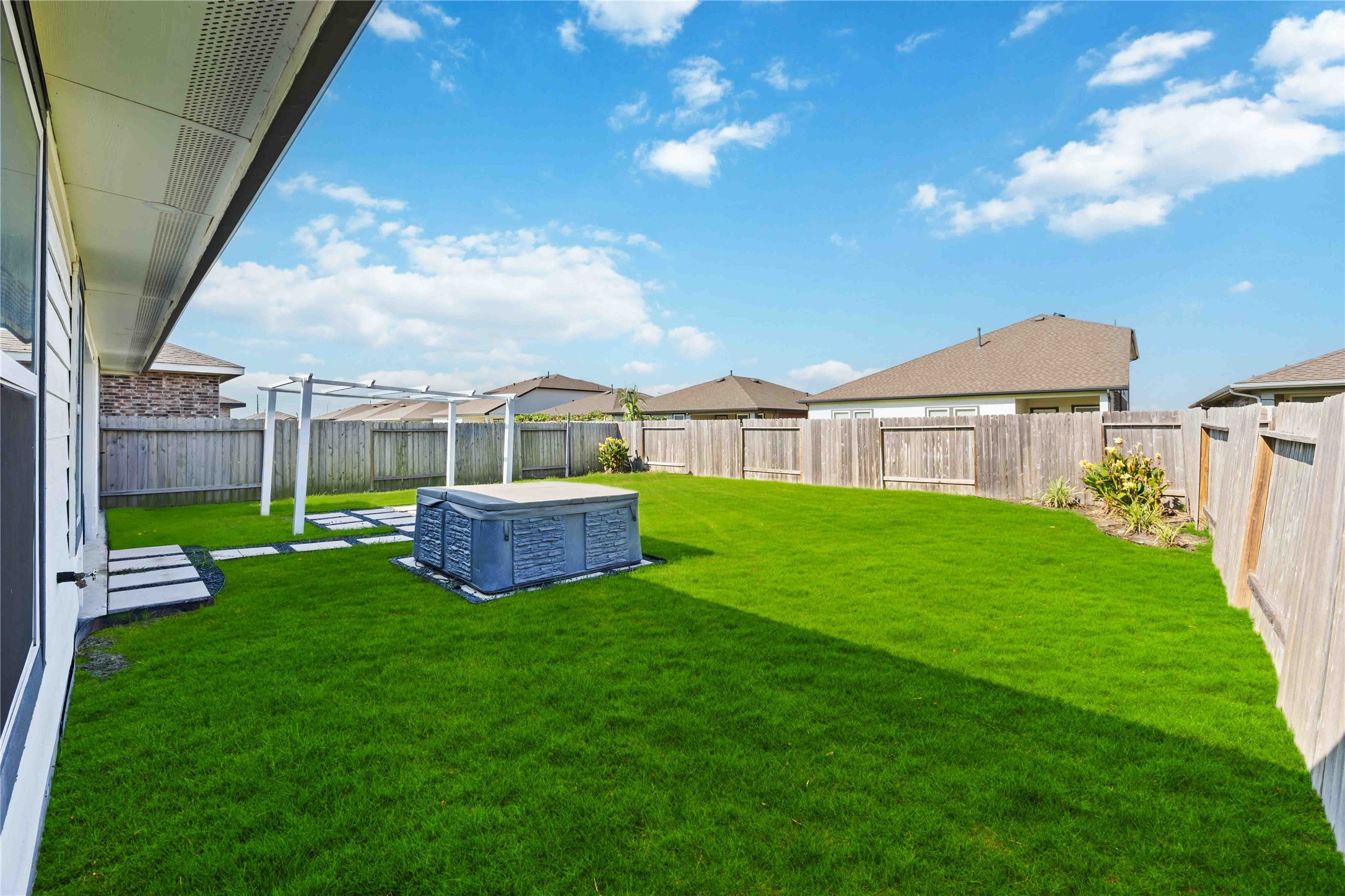 7826 Cattleman Vly Drive Rosharon, TX 77583 - Photo 28 of 29 a view of an house with backyard and a garden