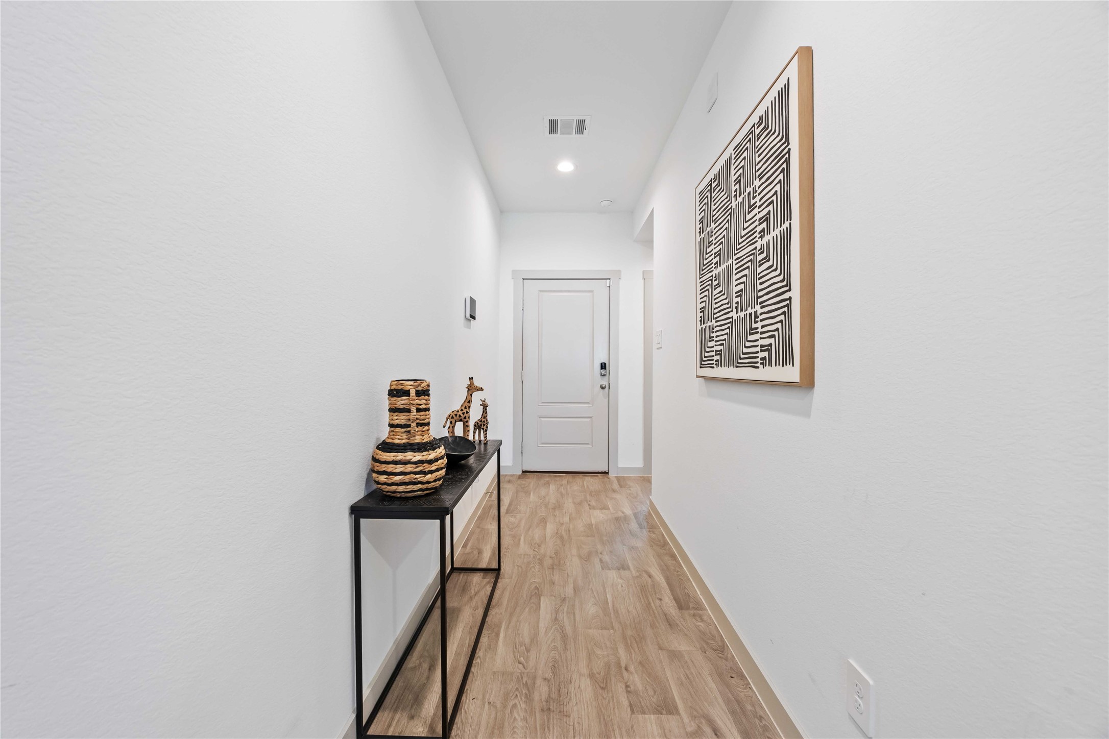 7826 Cattleman Vly Drive Rosharon, TX 77583 - Photo 3 of 29 a view of a hallway with wooden floor