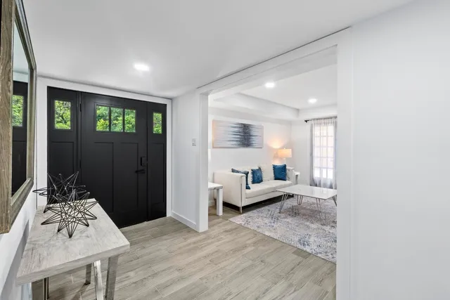 a living room with furniture and a table