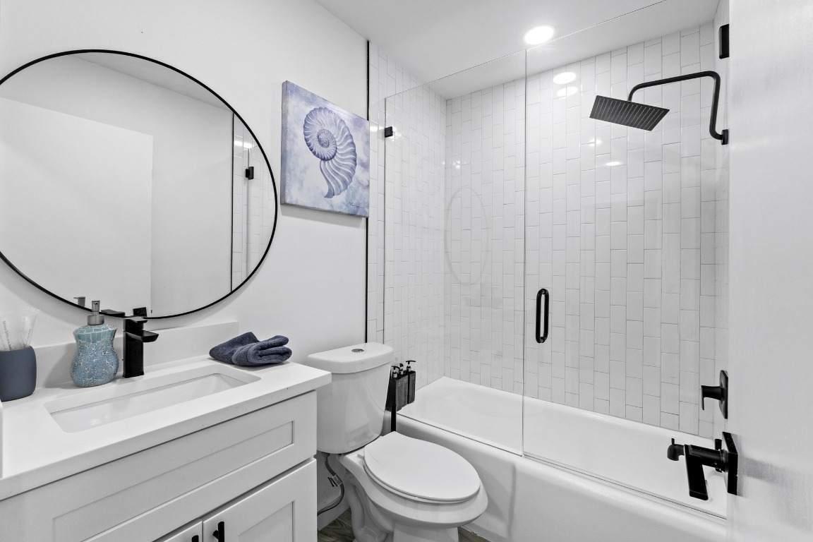 3520 Highland View Drive Austin, TX 78731 - Photo 30 of 38 a bathroom with a sink a toilet and a mirror