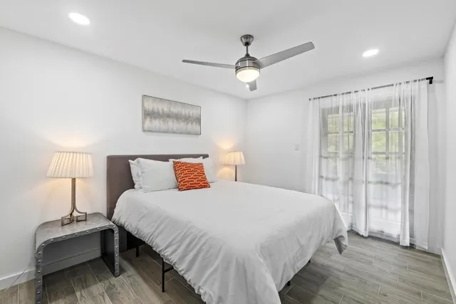 a bedroom with a bed and a window