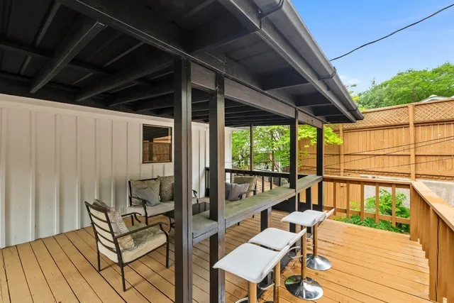 a view of two chairs in the balcony
