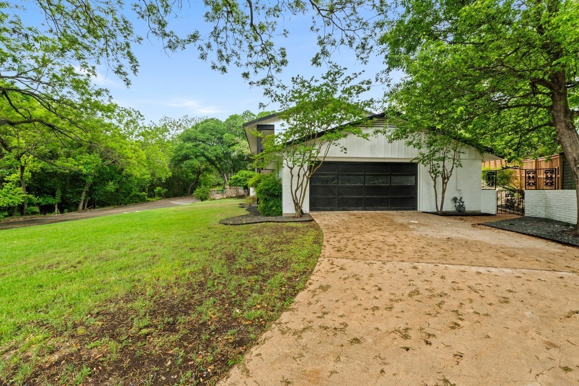 3520 Highland View Drive Austin, TX 78731 - Photo 4 of 38 a front view of a house with a yard