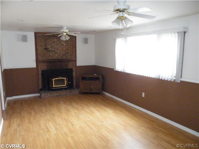 9609 Krause Road Chesterfield, VA 23832 - Photo 10 of 17 a view of an empty room with a fireplace and a window