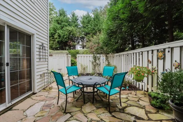 a view of a chairs and table in the patio