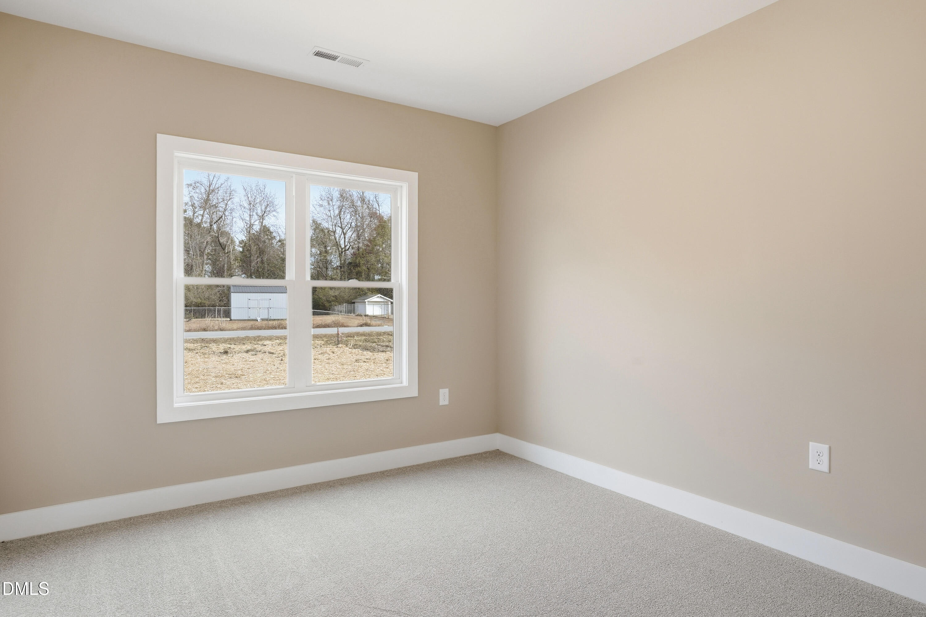 1115 Jada Allen Road Dunn, NC 28334 - Photo 19 of 32 an empty room with a window