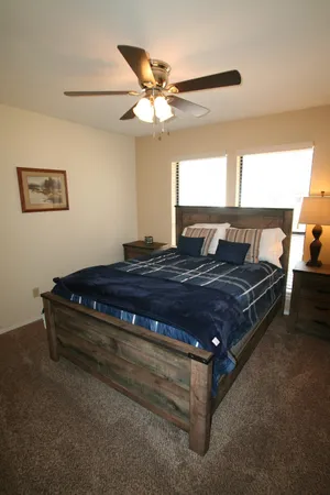 a bedroom with a bed and window