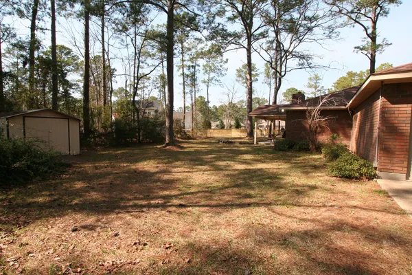a backyard of a house with lots of green space