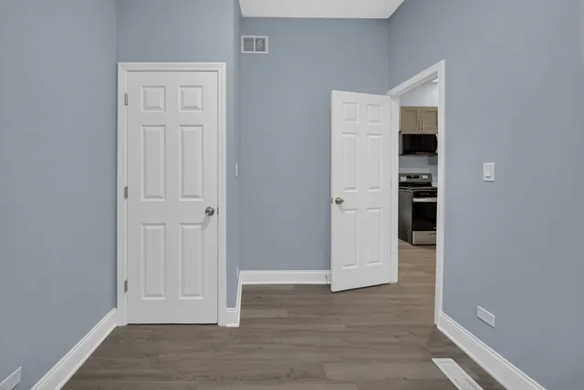 wooden floor and closet in a room