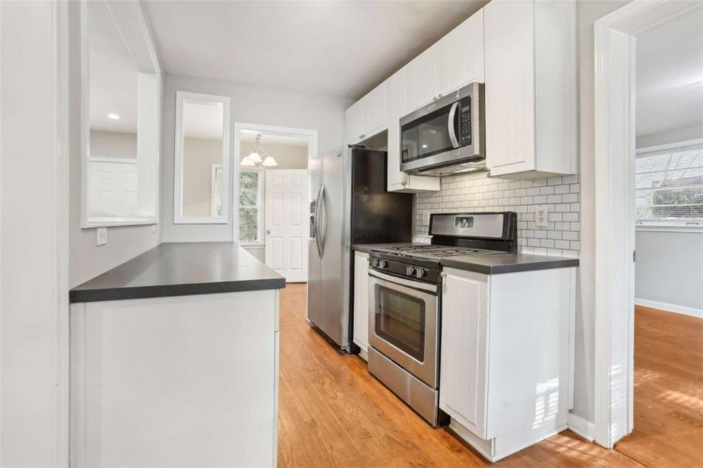 1840 Camellia Drive Decatur, GA 30032 - Photo 13 of 28 a kitchen with a stove microwave and refrigerator
