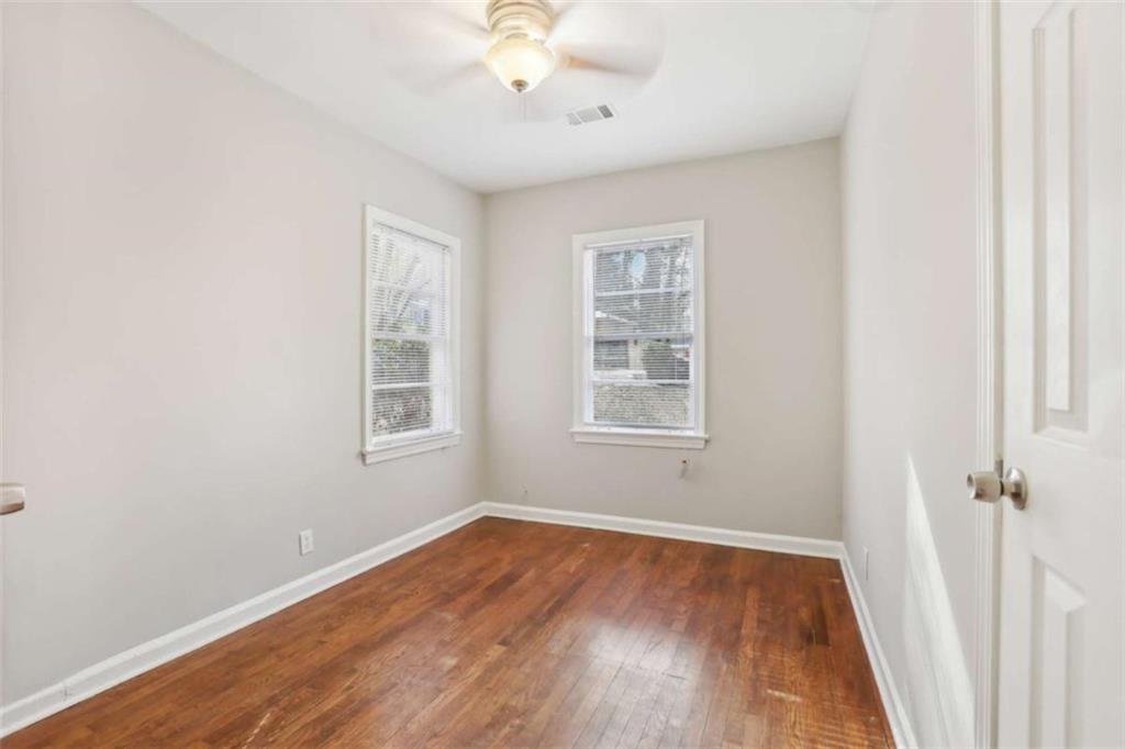 1840 Camellia Drive Decatur, GA 30032 - Photo 20 of 28 an empty room with wooden floor and windows