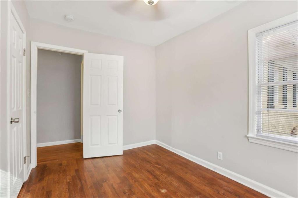 1840 Camellia Drive Decatur, GA 30032 - Photo 21 of 28 a view of an empty room with wooden floor and a window