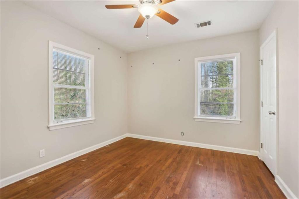 1840 Camellia Drive Decatur, GA 30032 - Photo 24 of 28 a view of an empty room with wooden floor and a window
