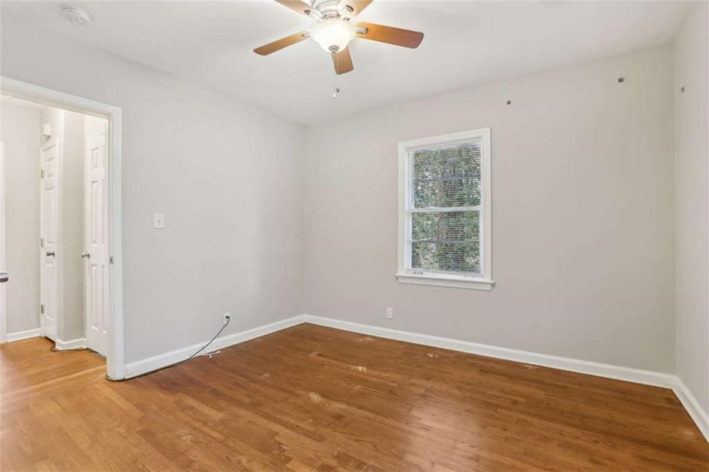 1840 Camellia Drive Decatur, GA 30032 - Photo 25 of 28 wooden floor in an empty room with a window