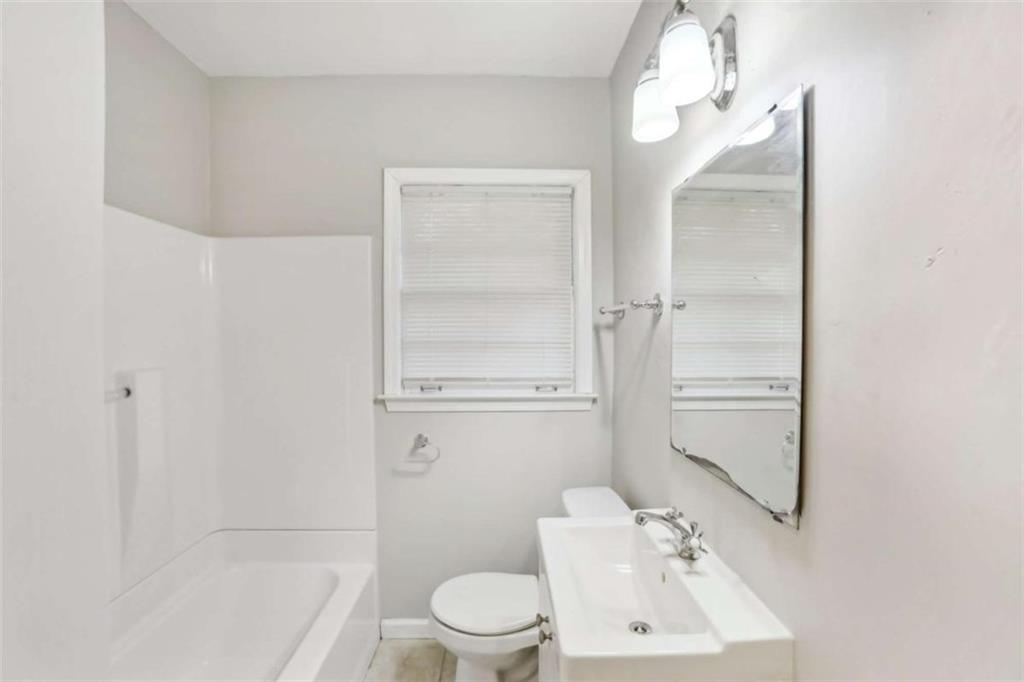 1840 Camellia Drive Decatur, GA 30032 - Photo 26 of 28 a bathroom with a sink a toilet and shower