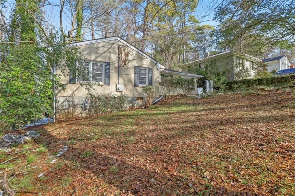 1840 Camellia Drive Decatur, GA 30032 - Photo 3 of 28 a front view of a house with a yard