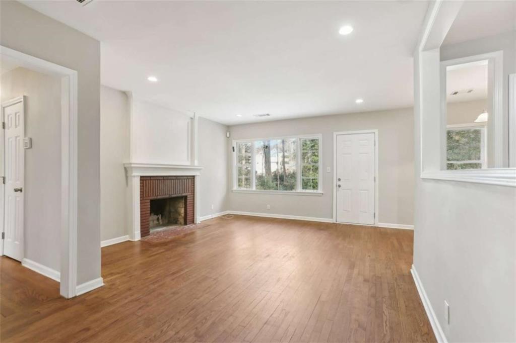 1840 Camellia Drive Decatur, GA 30032 - Photo 5 of 28 a view of an empty room with wooden floor and a window