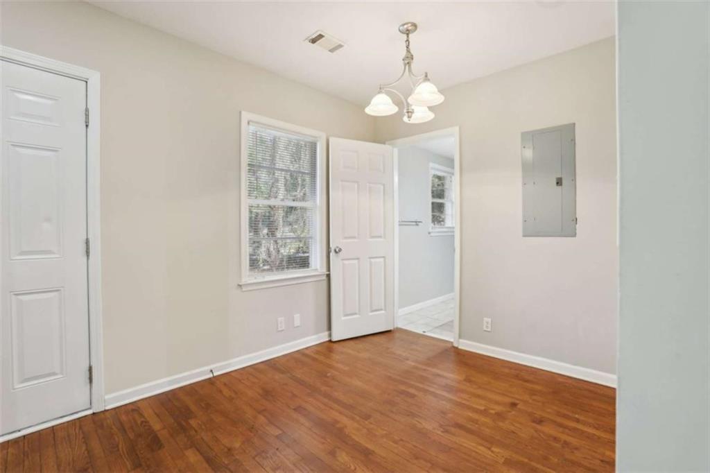 1840 Camellia Drive Decatur, GA 30032 - Photo 10 of 28 wooden floor in an empty room with a window