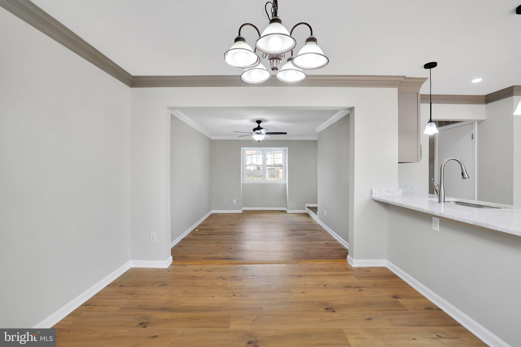 815 Cedar Court La Plata, MD 20646 - Photo 11 of 43 a view of an empty room with wooden floor and a window
