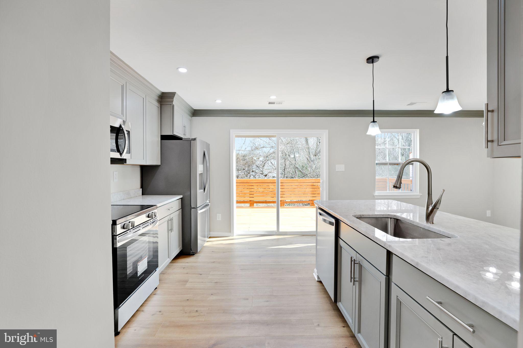 815 Cedar Court La Plata, MD 20646 - Photo 14 of 43 a kitchen with stainless steel appliances granite countertop a sink stove and refrigerator