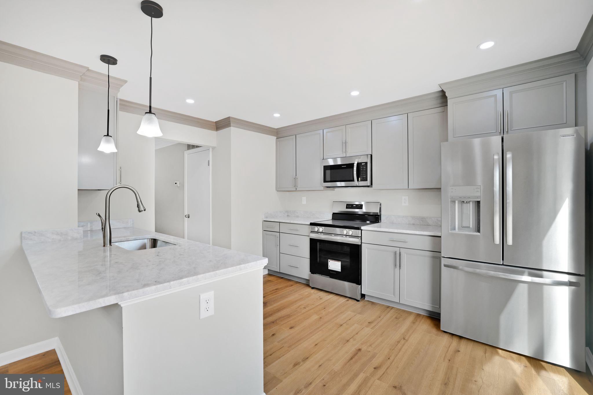 815 Cedar Court La Plata, MD 20646 - Photo 15 of 43 a kitchen with stainless steel appliances a refrigerator sink and microwave