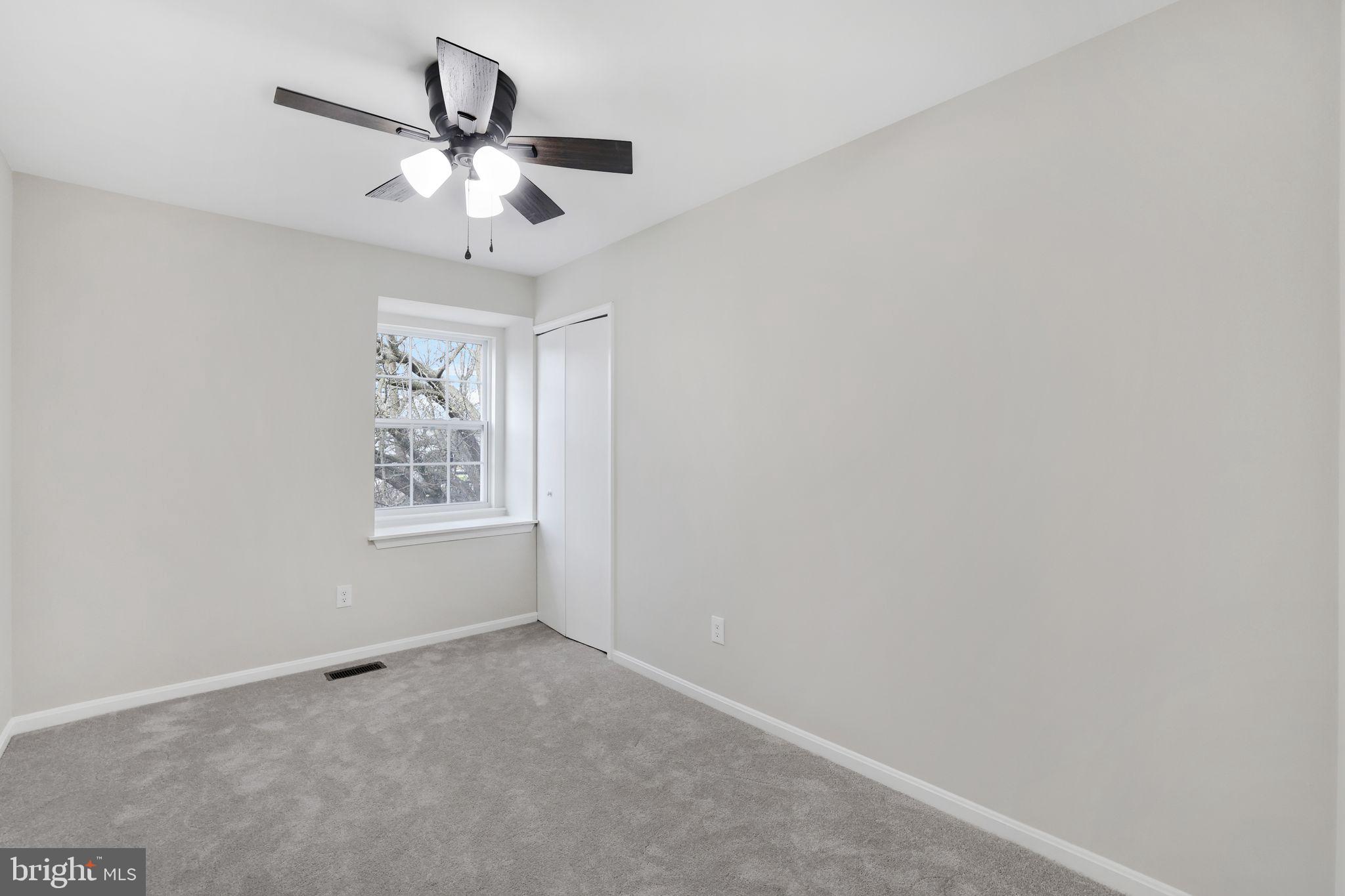 815 Cedar Court La Plata, MD 20646 - Photo 19 of 43 an empty room with a window and a fan