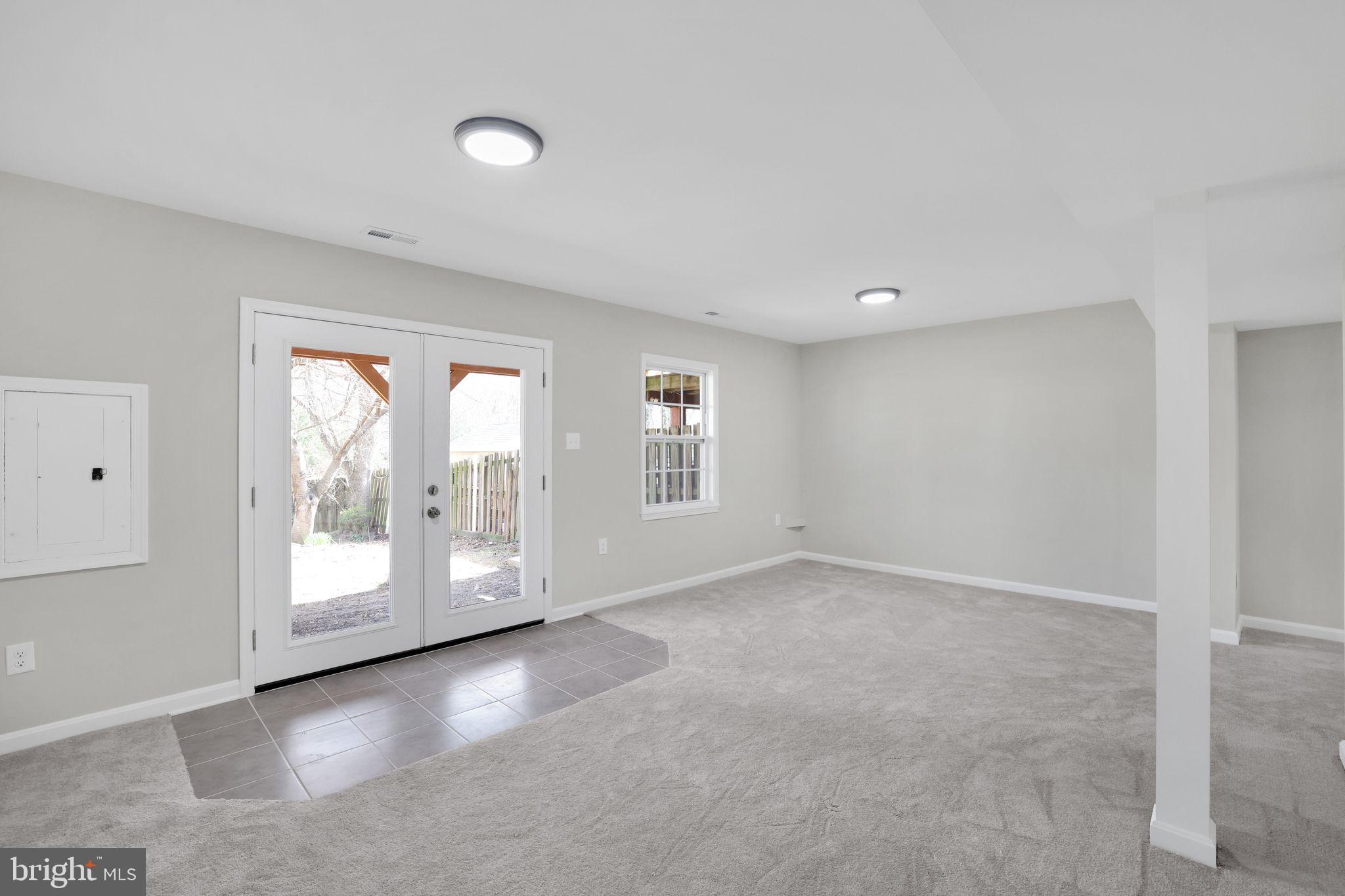 815 Cedar Court La Plata, MD 20646 - Photo 32 of 43 a view of an empty room with a window and wooden floor