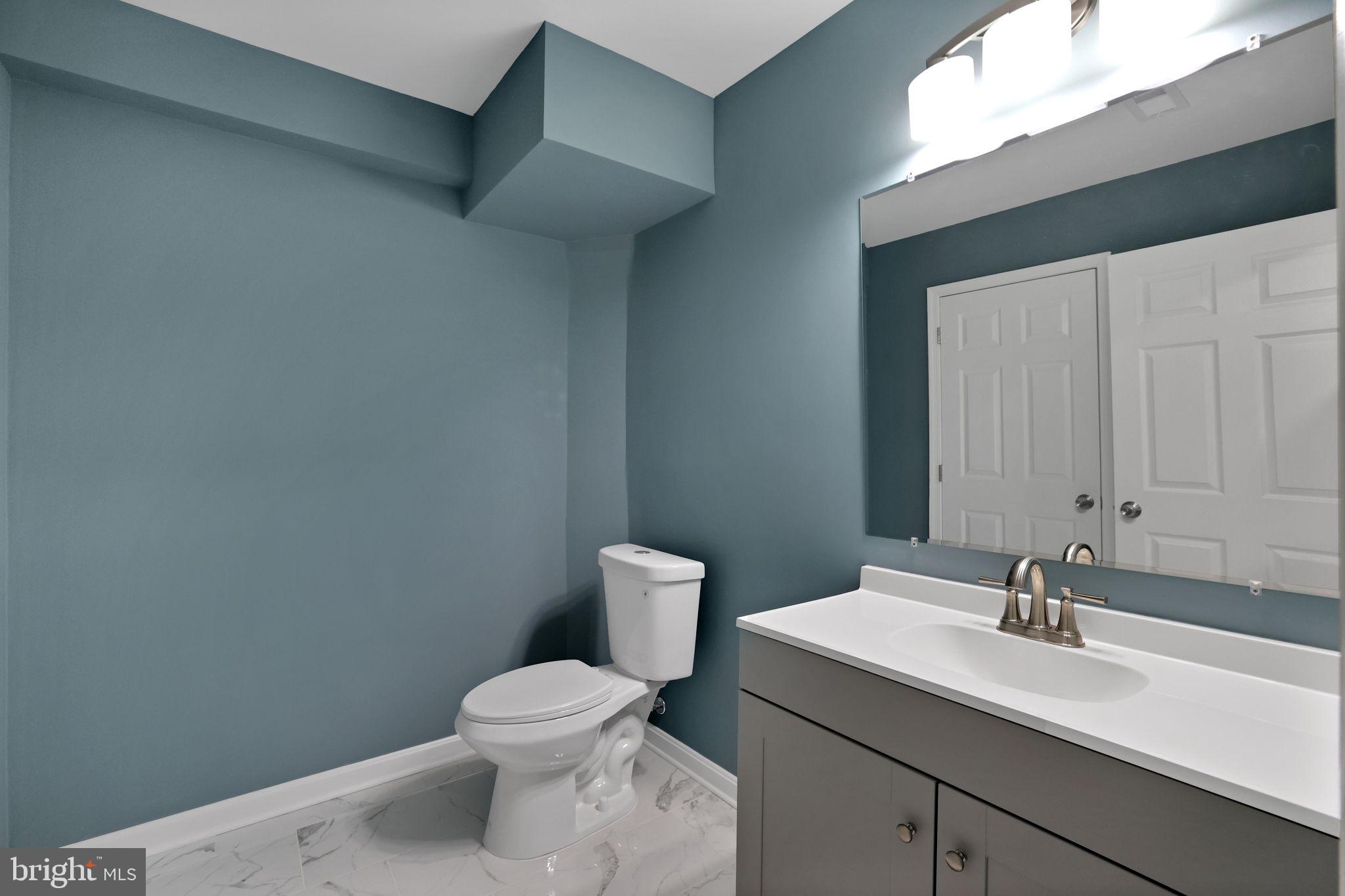 815 Cedar Court La Plata, MD 20646 - Photo 35 of 43 a bathroom with a toilet sink and mirror