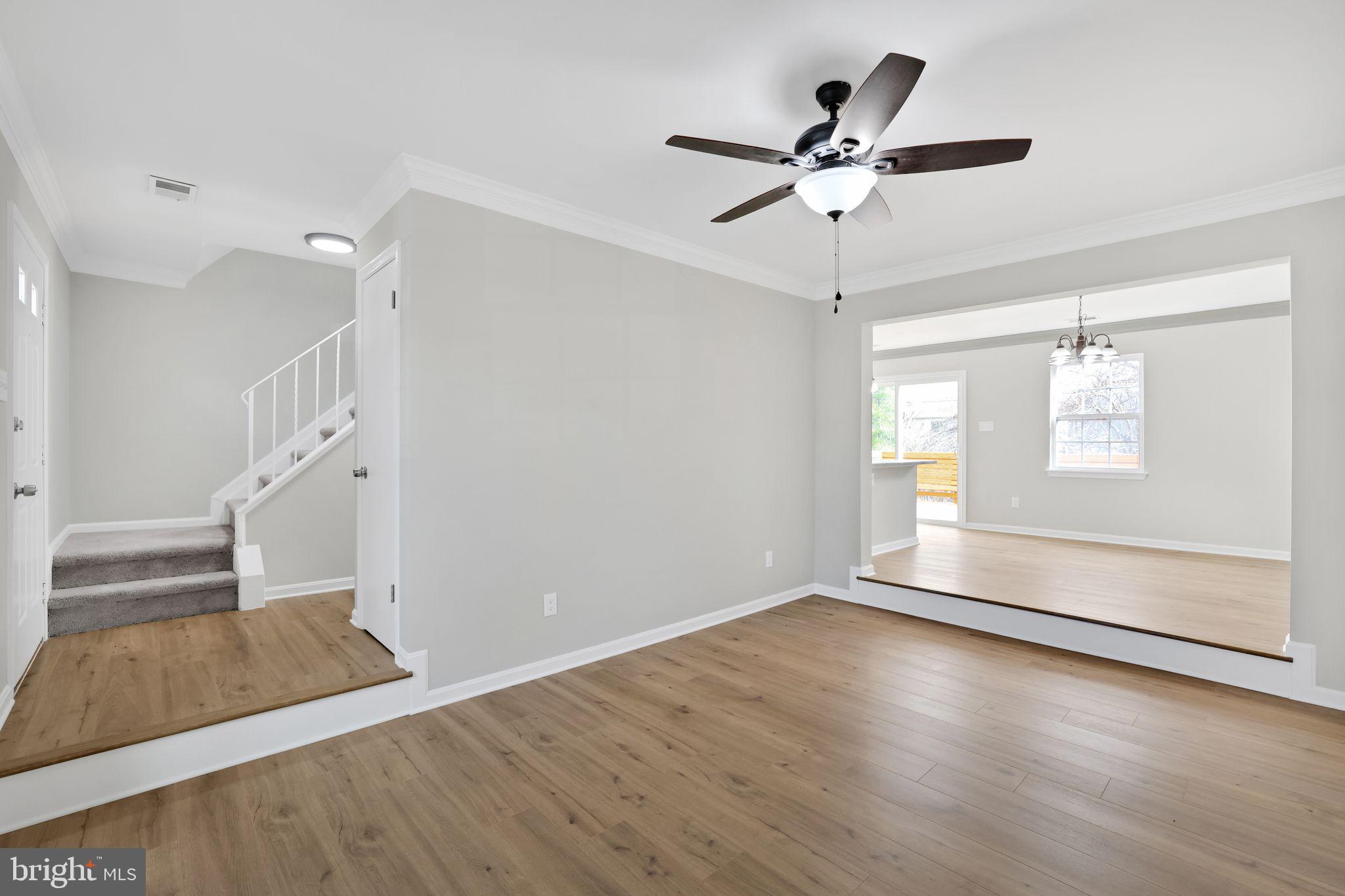 815 Cedar Court La Plata, MD 20646 - Photo 4 of 43 a view of empty room with wooden floor and ceiling fan