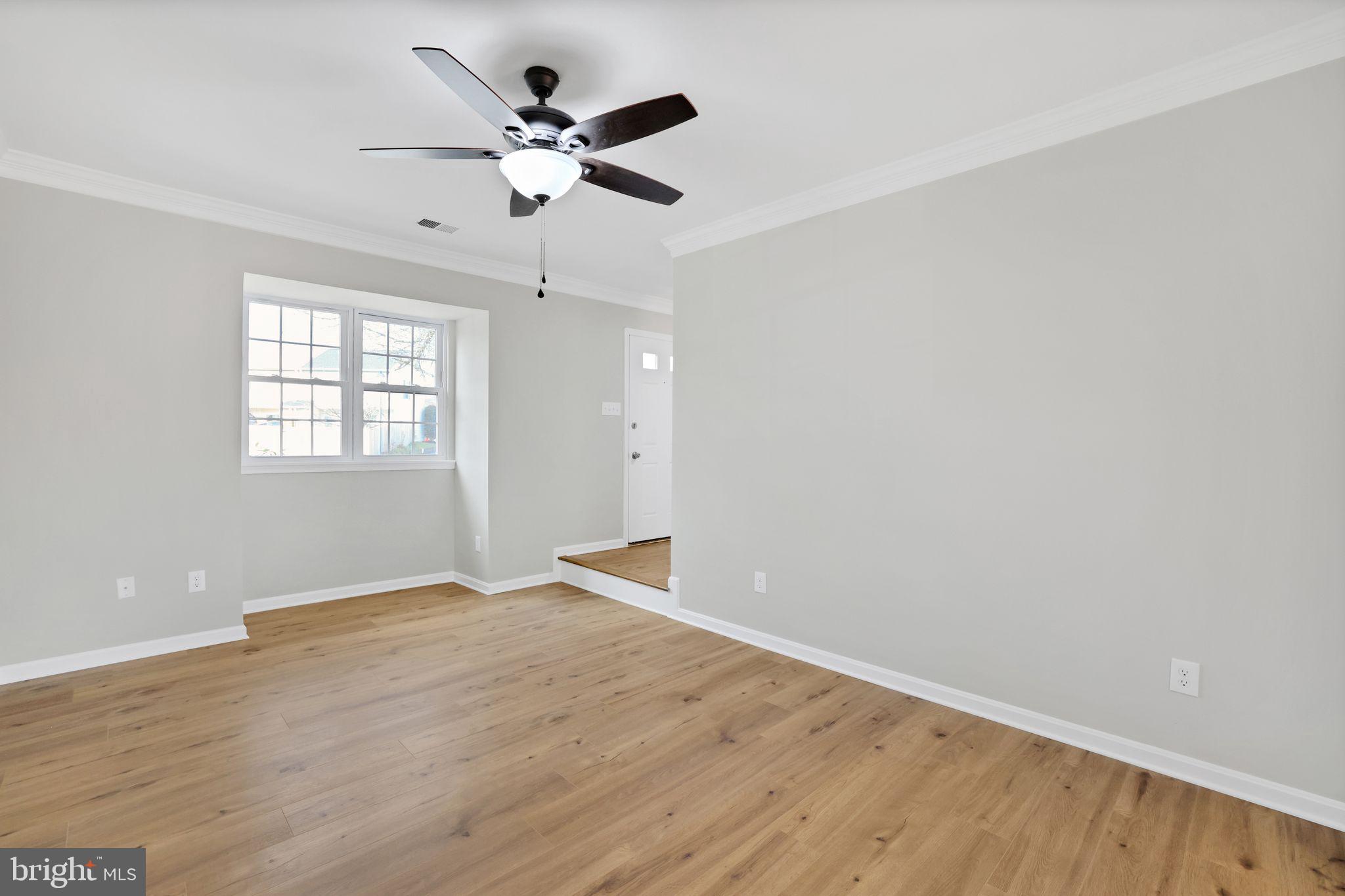 815 Cedar Court La Plata, MD 20646 - Photo 5 of 43 wooden floor in an empty room with a window