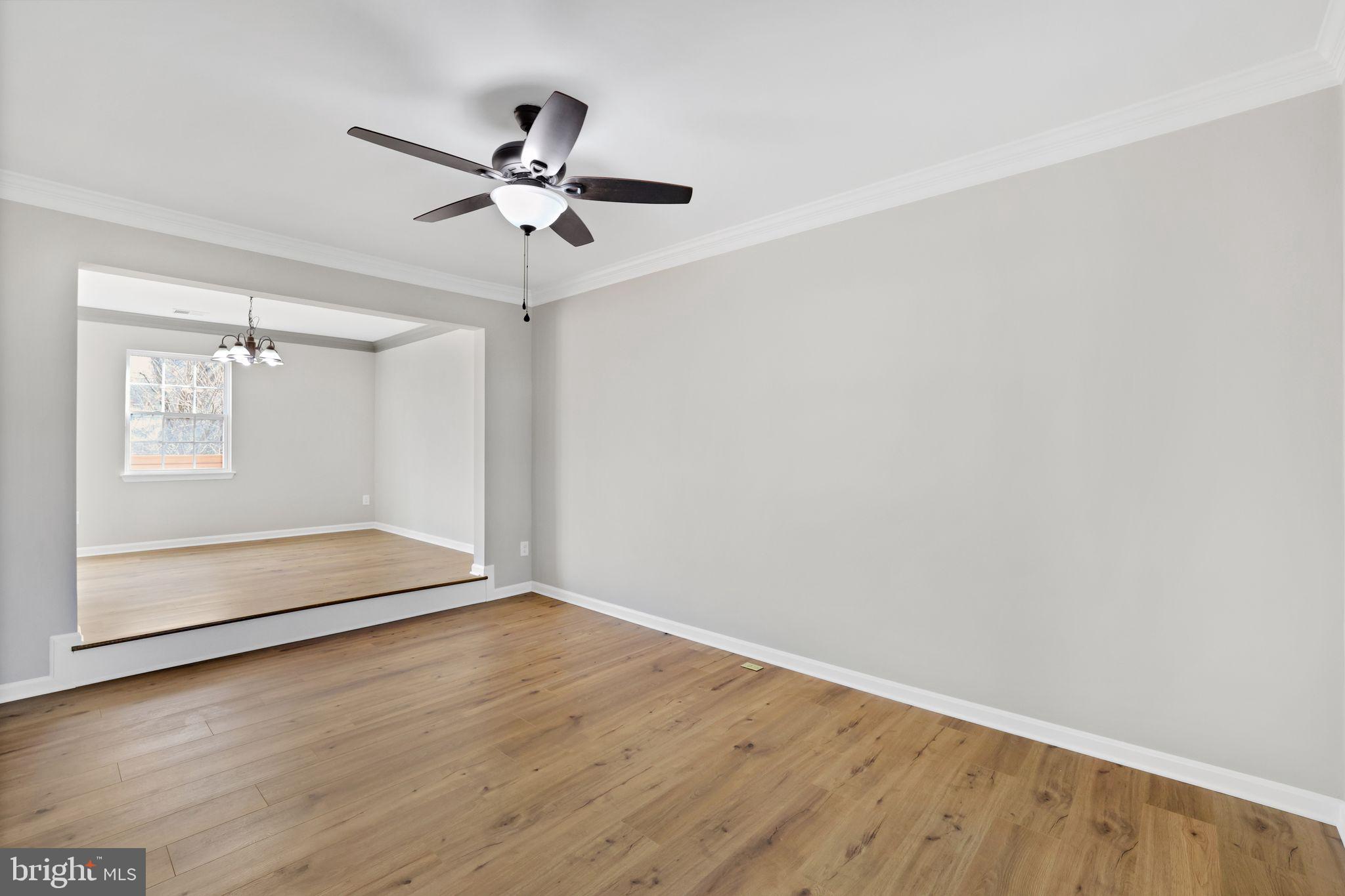 815 Cedar Court La Plata, MD 20646 - Photo 7 of 43 an empty room with wooden floor closet and fan