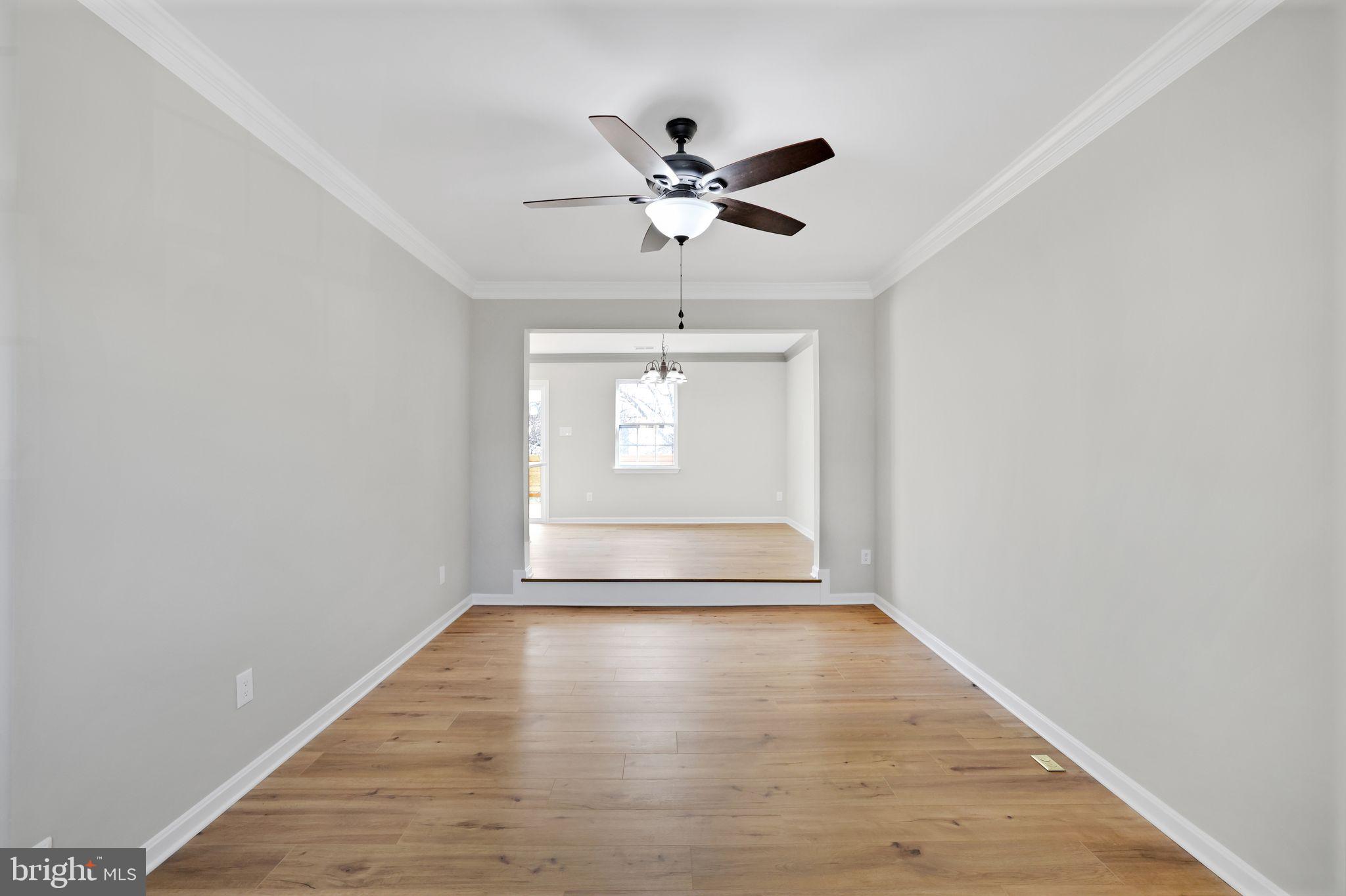 815 Cedar Court La Plata, MD 20646 - Photo 8 of 43 a view of empty room with wooden floor and fan