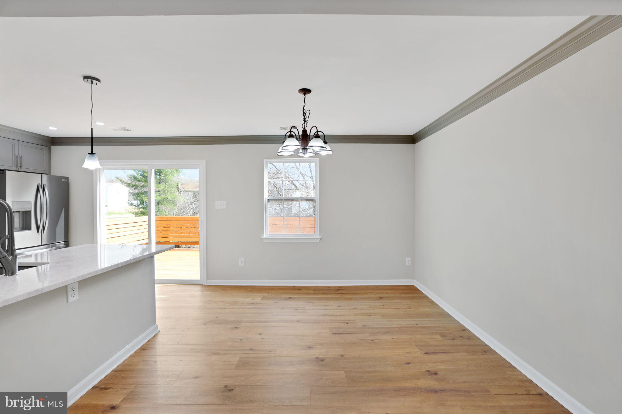 815 Cedar Court La Plata, MD 20646 - Photo 10 of 43 an empty room with wooden floor and windows